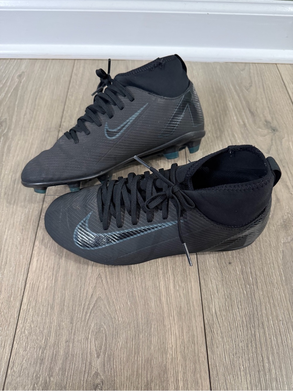 Nike Black Kids High-Cut Soccer Cleats with Swoosh